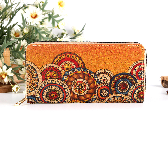 A long multi functional wallet with a zippered ethnic print pattern