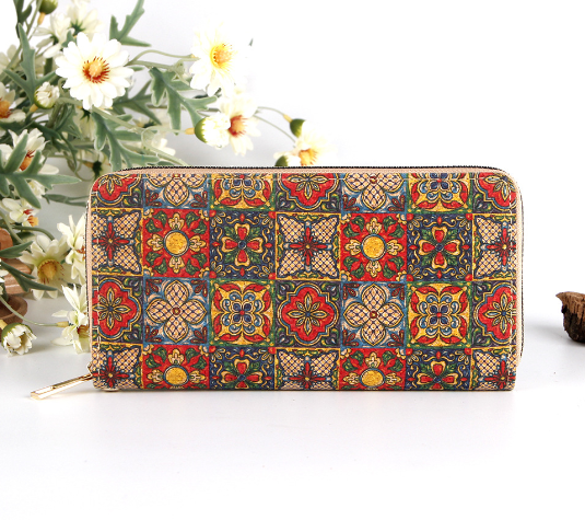 long multi functional wallet with a zippered ethnic print pattern